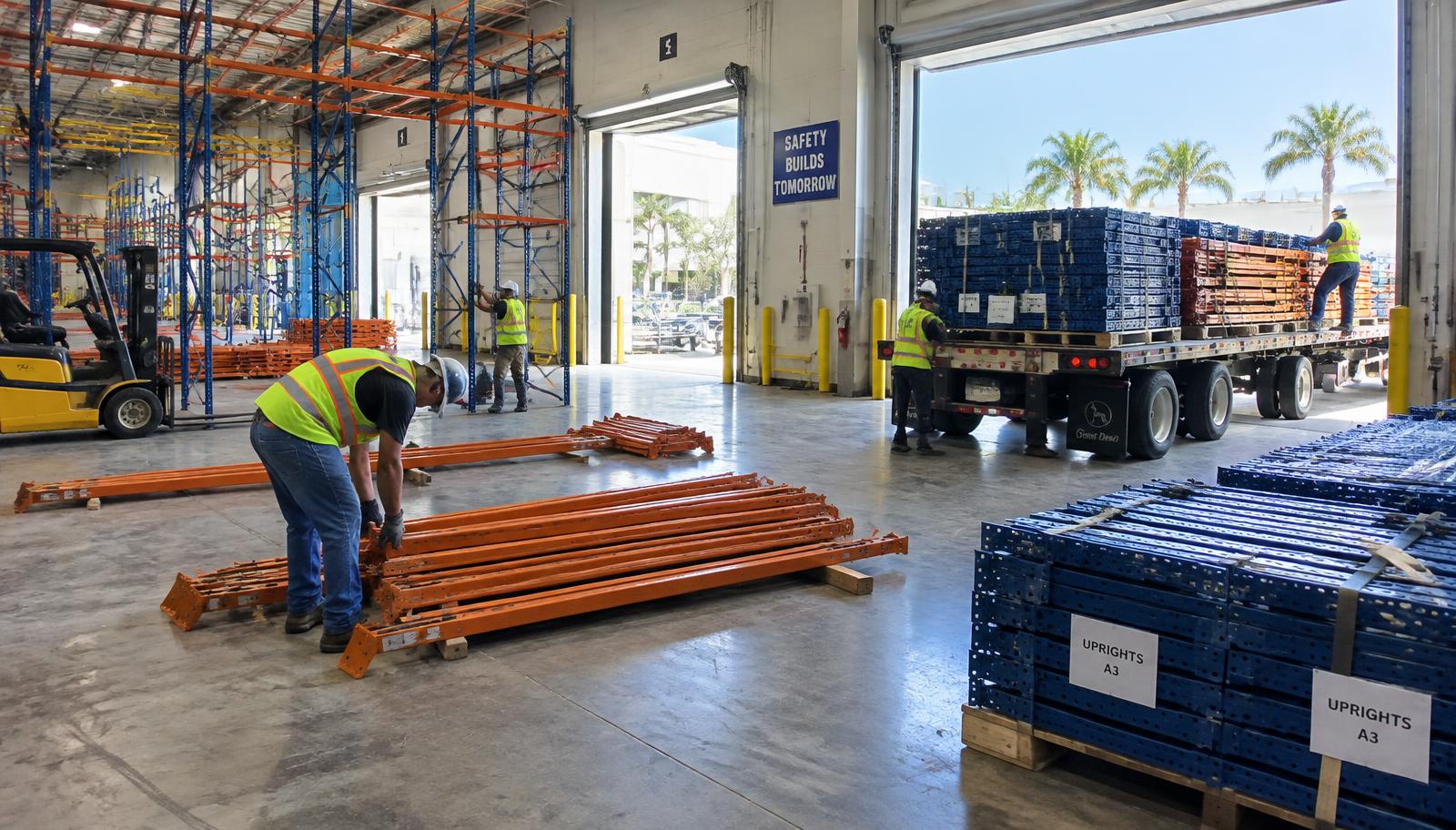 Pallet rack teardown and loading during a South Florida warehouse relocation